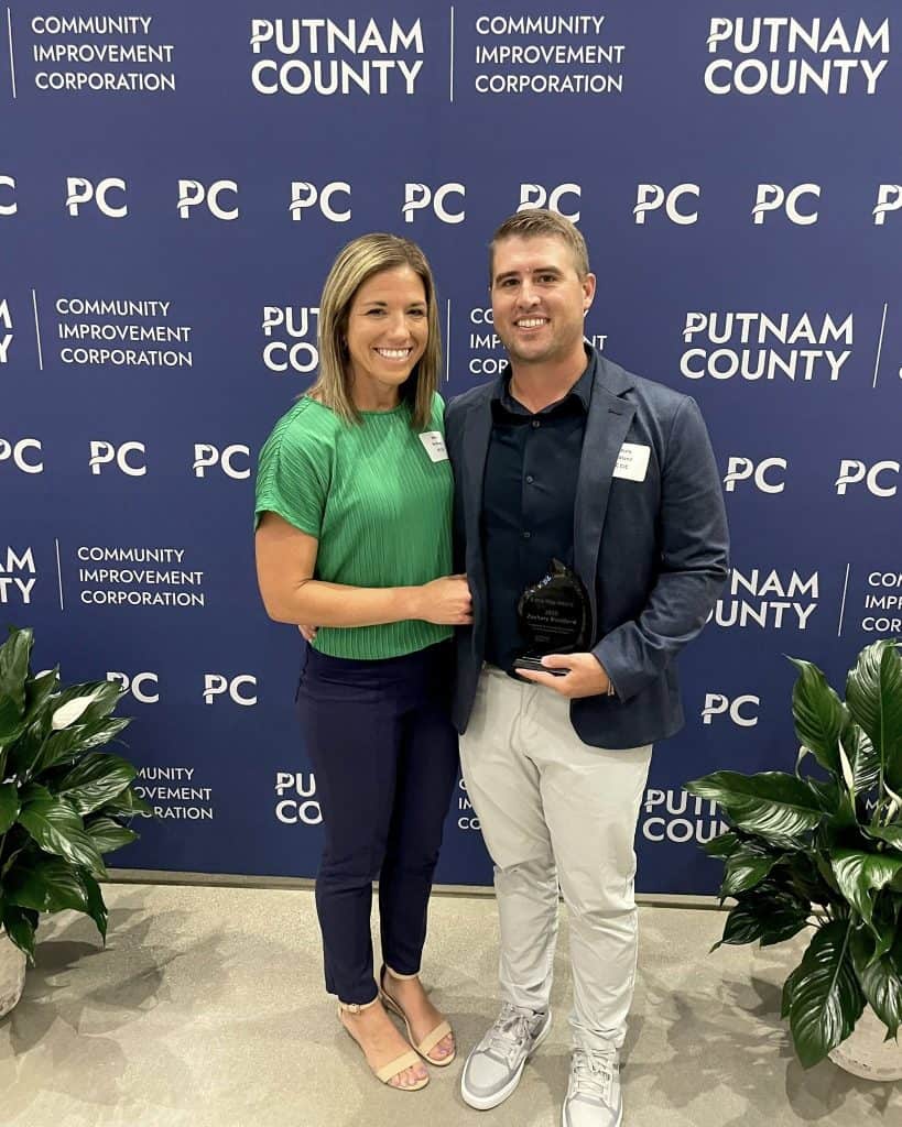 Zachary Buckland, The Extra Mile Award, pictured with Jenna Buckland